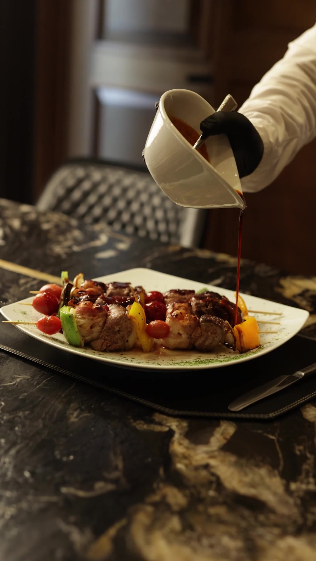 Aspen restaurant — sauce being poured over skewers